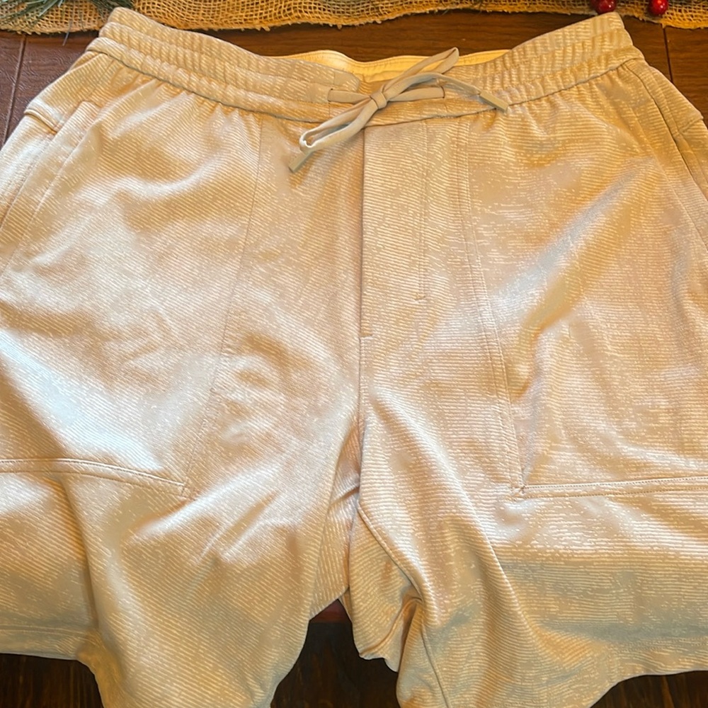 Men’s size medium Lululemon tan athletic shorts.